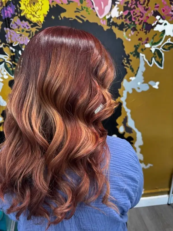 Close-up of blonde hair with fresh full highlights.